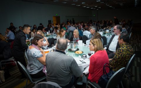 Attendees enjoying dinner